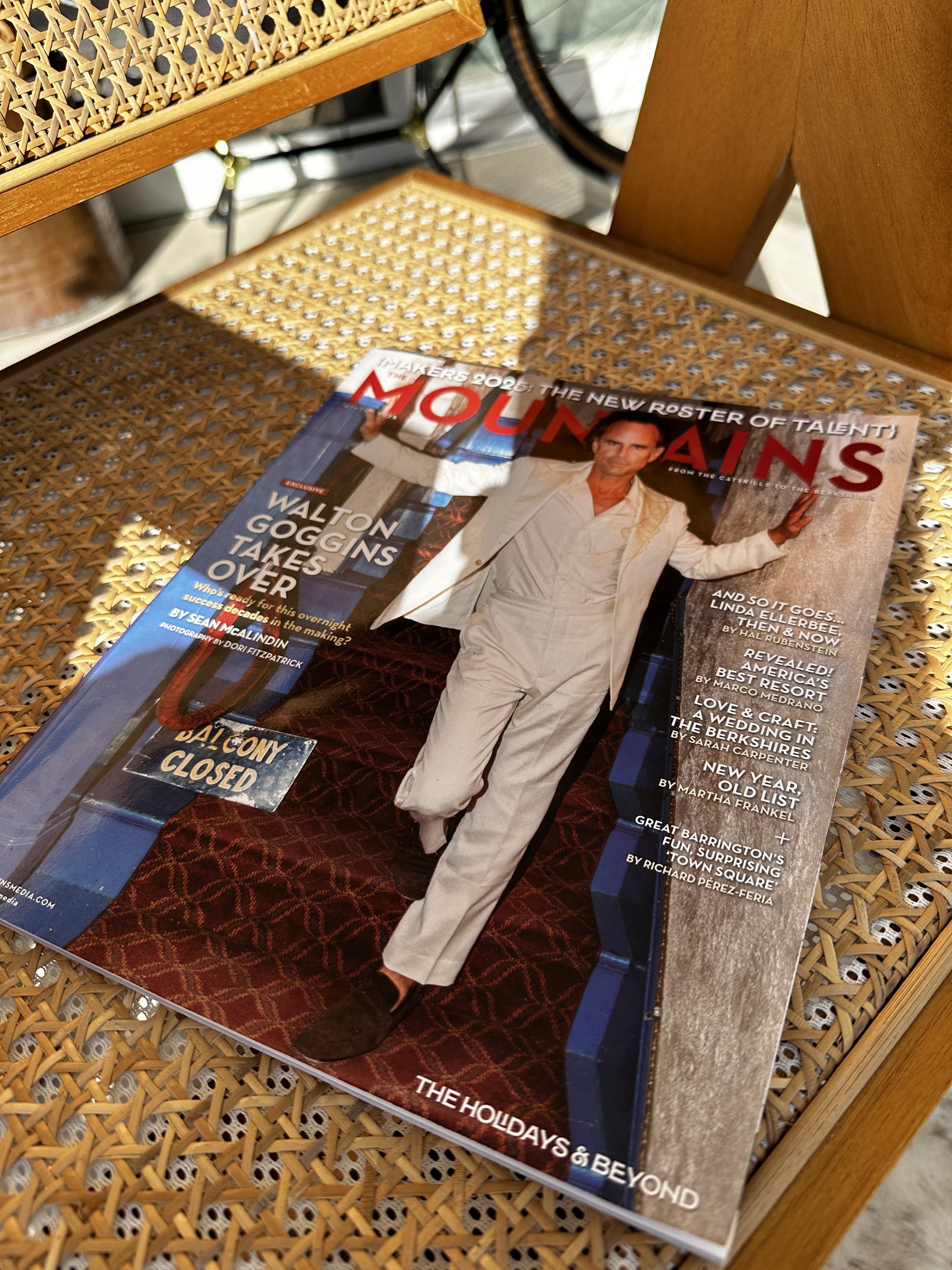 A local magazine featuring Walton Goggins photographed on a woven cane chair